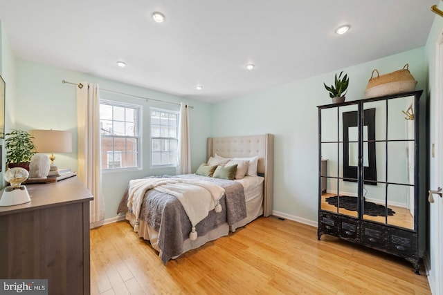 bedroom with light hardwood / wood-style flooring