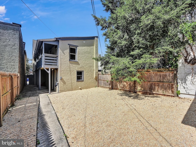 back of property with a patio area