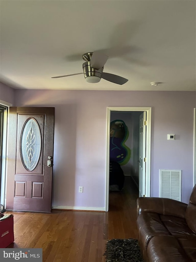 foyer with wood-type flooring and ceiling fan