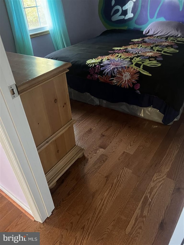 bedroom featuring wood-type flooring