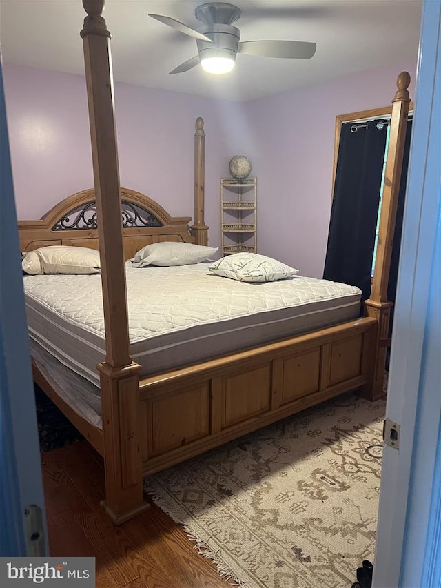 bedroom featuring hardwood / wood-style flooring and ceiling fan