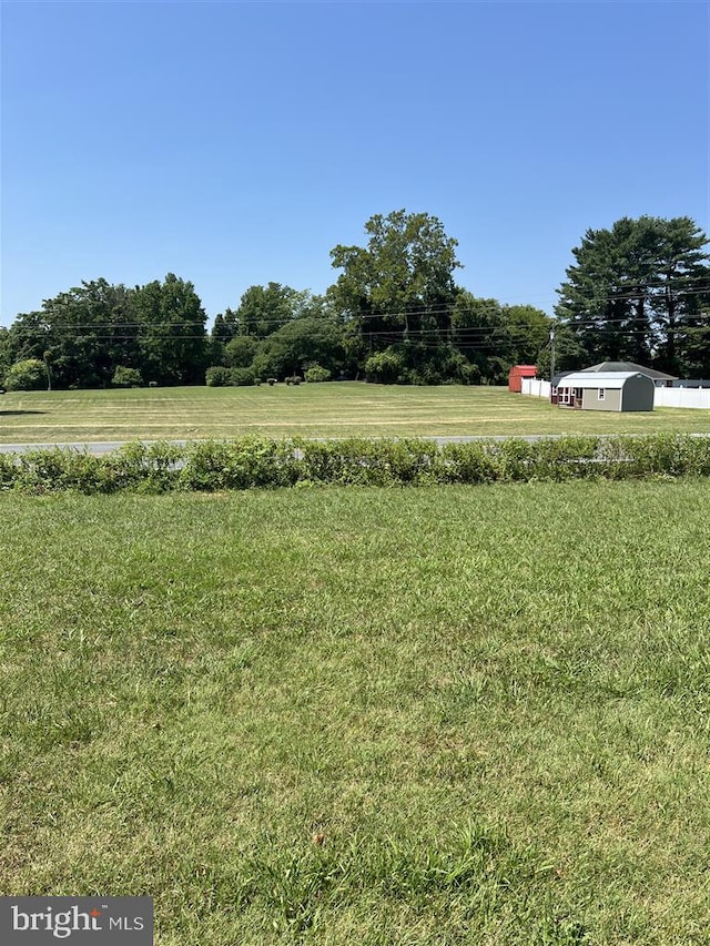 view of yard with a rural view