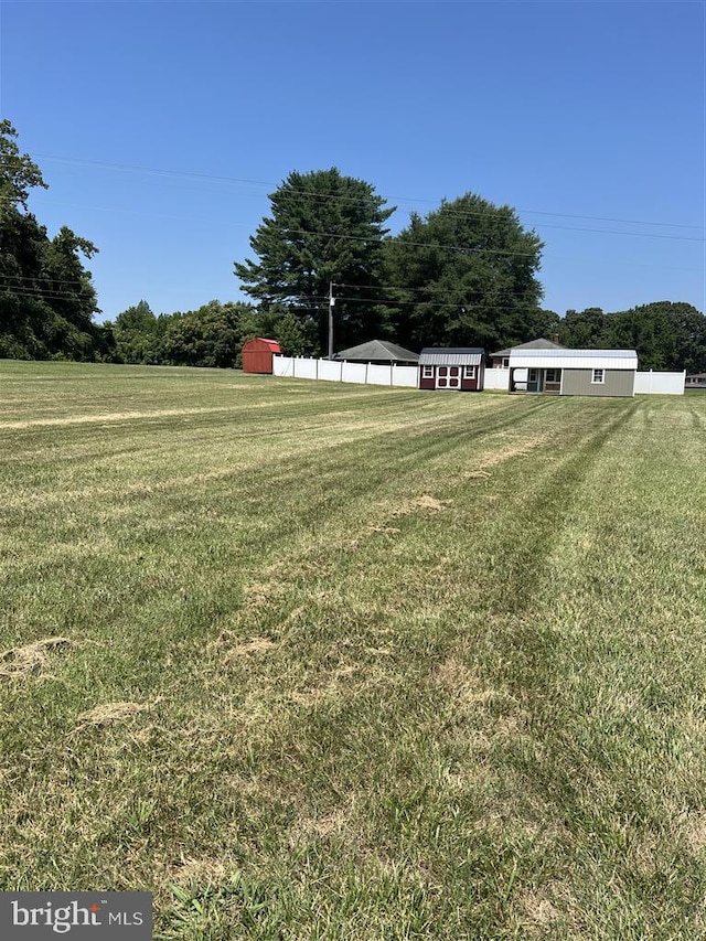 view of yard with a rural view