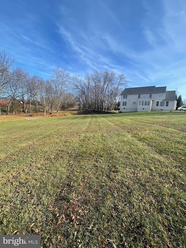 view of yard with a rural view