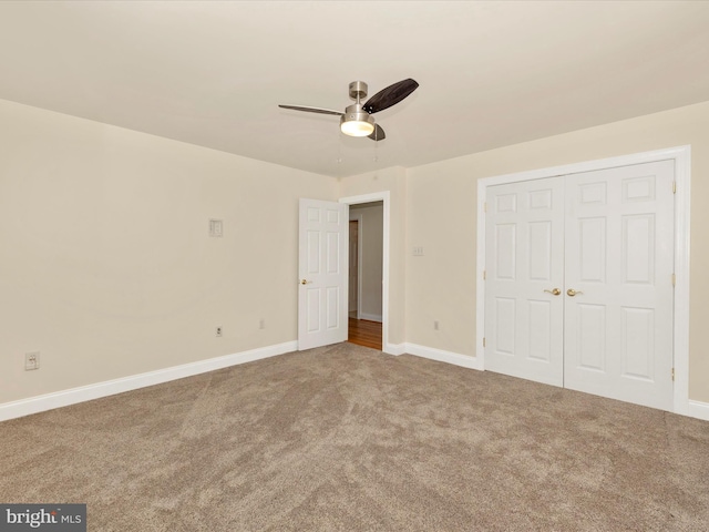 unfurnished bedroom featuring ceiling fan, carpet floors, and a closet