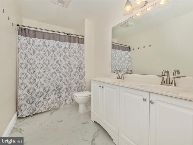 bathroom with vanity, a shower with shower curtain, and toilet