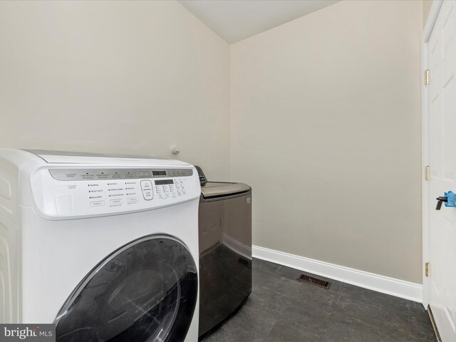 washroom featuring washer and dryer