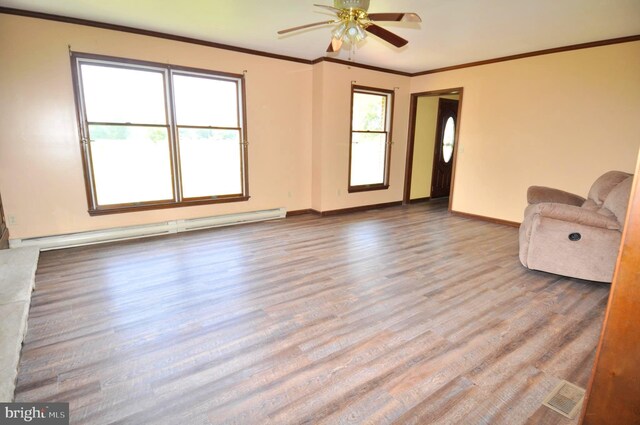 unfurnished living room featuring light wood-type flooring, ornamental molding, ceiling fan, and a baseboard radiator