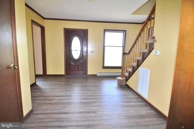 entryway featuring ornamental molding, dark wood-type flooring, and a baseboard radiator