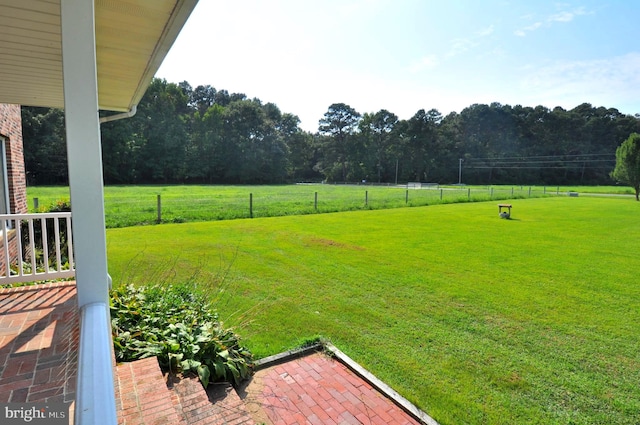 view of yard with a rural view