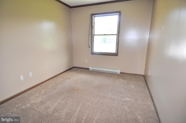 unfurnished room with a baseboard radiator, ornamental molding, and carpet