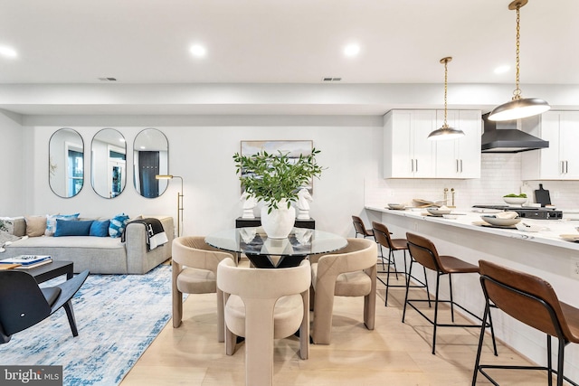 dining area featuring light hardwood / wood-style floors