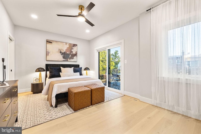 bedroom featuring access to exterior, ceiling fan, and light hardwood / wood-style floors