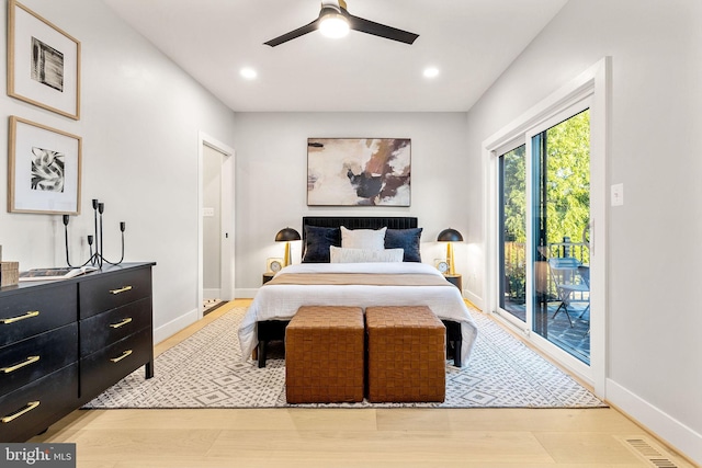 bedroom with ceiling fan and light hardwood / wood-style floors