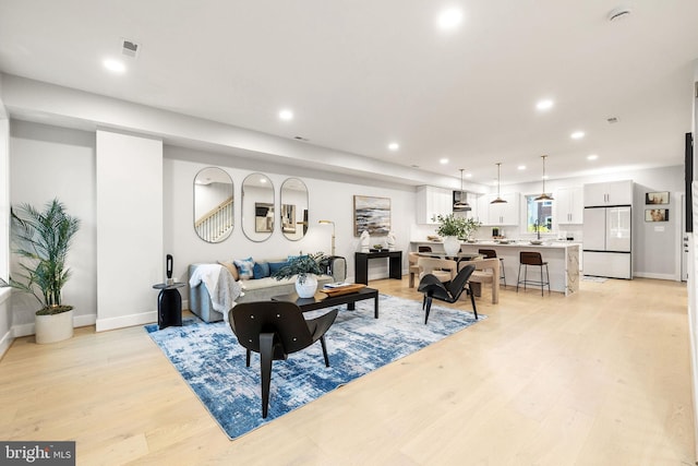 living room with light hardwood / wood-style floors