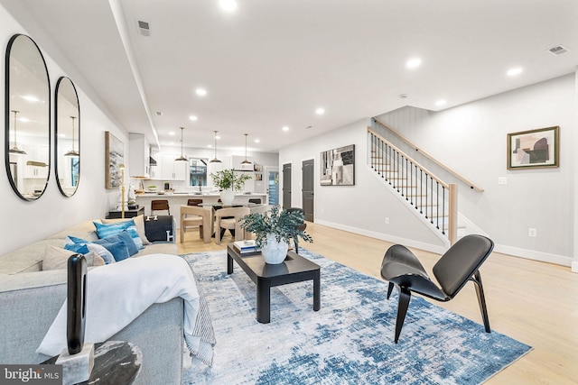 living room with light hardwood / wood-style flooring