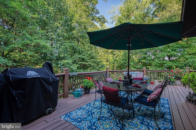 wooden deck featuring area for grilling