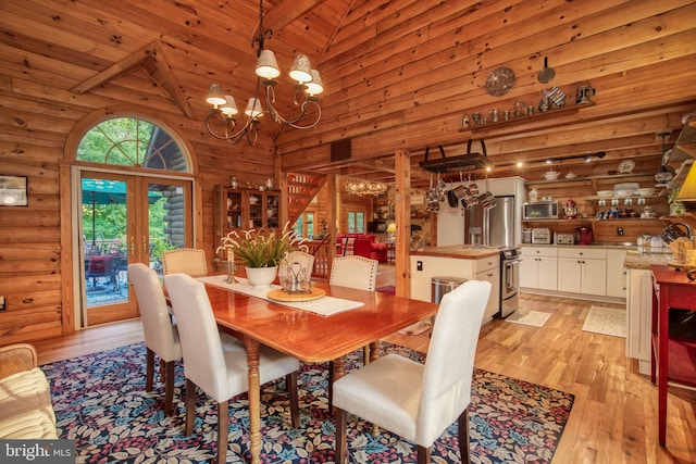 dining area featuring high vaulted ceiling, french doors, light hardwood / wood-style flooring, beamed ceiling, and a notable chandelier