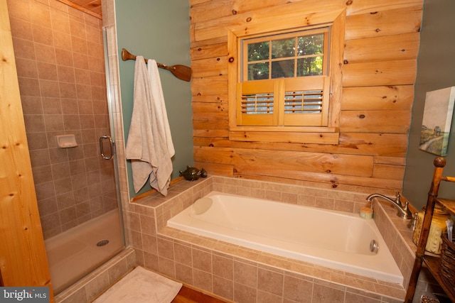 bathroom with separate shower and tub