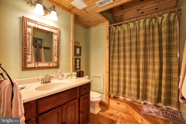 full bathroom featuring wood-type flooring, toilet, shower / tub combo with curtain, vanity, and wood ceiling