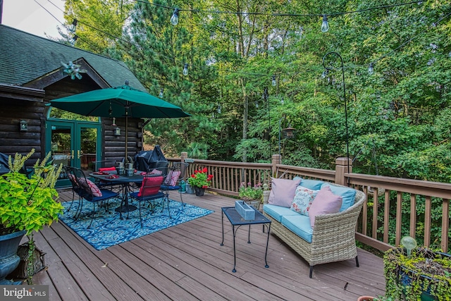 wooden terrace featuring an outdoor living space