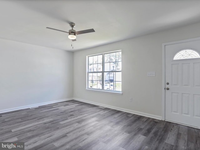 foyer with ceiling fan and dark hardwood / wood-style flooring