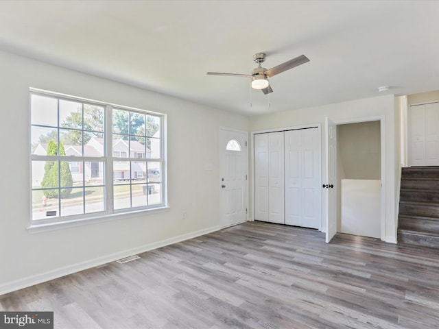 interior space featuring ceiling fan and light wood-type flooring