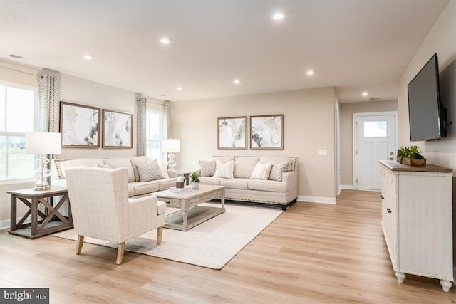 living room with light hardwood / wood-style flooring