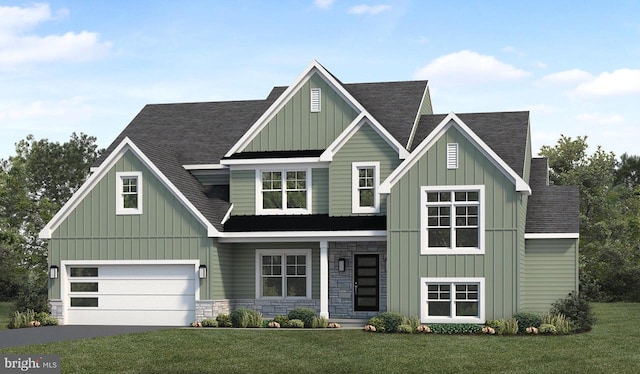 view of front of house with a front yard, a garage, board and batten siding, and roof with shingles