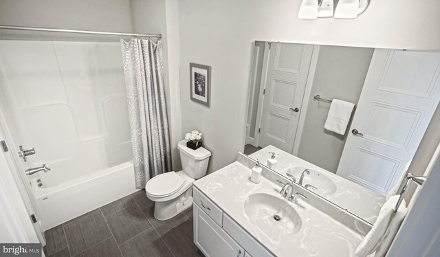 full bathroom featuring vanity, toilet, and shower / bath combo with shower curtain