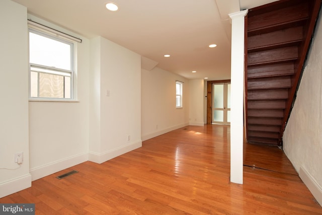 empty room with light hardwood / wood-style flooring