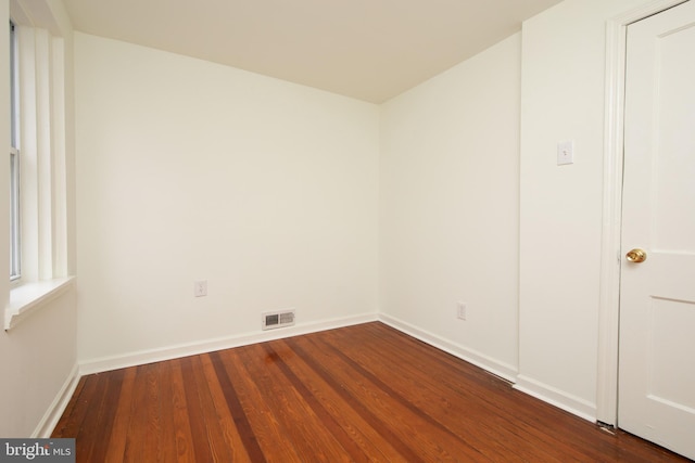 spare room with hardwood / wood-style floors