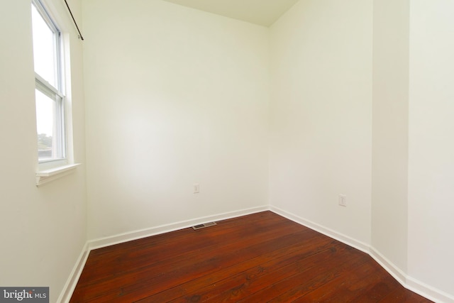 spare room featuring hardwood / wood-style floors