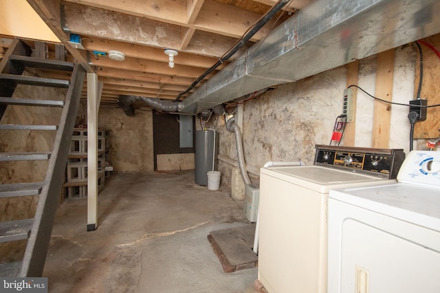 basement with water heater and independent washer and dryer