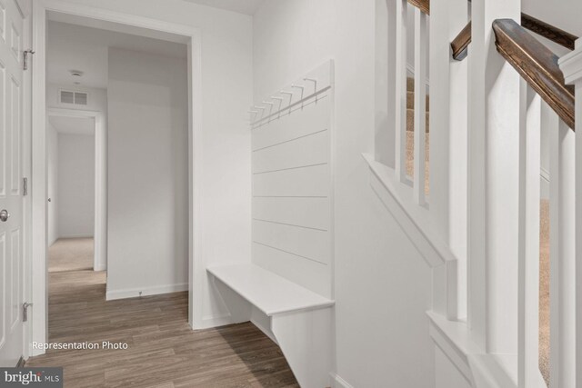 mudroom with hardwood / wood-style floors