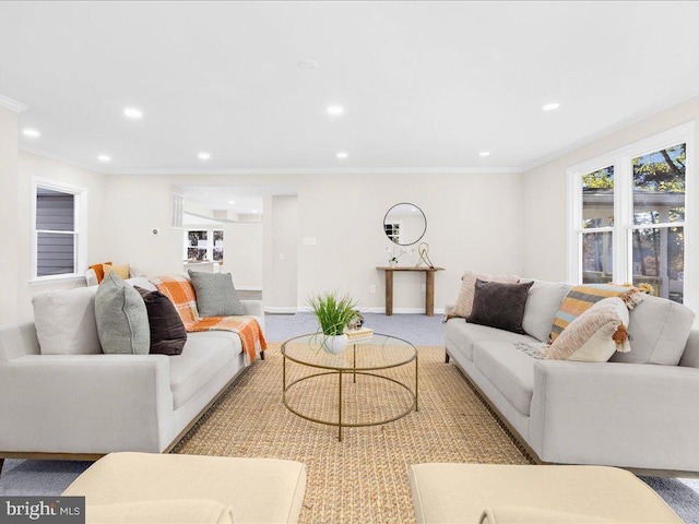 carpeted living room with ornamental molding