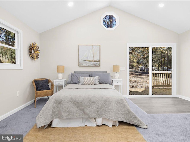 bedroom featuring access to outside, lofted ceiling, and hardwood / wood-style flooring