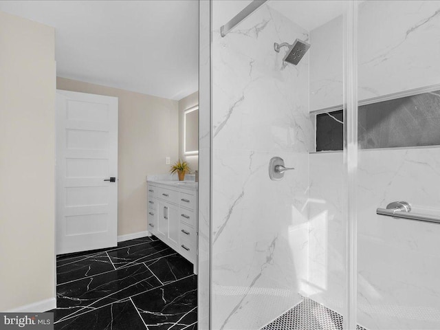 bathroom featuring vanity and tiled shower