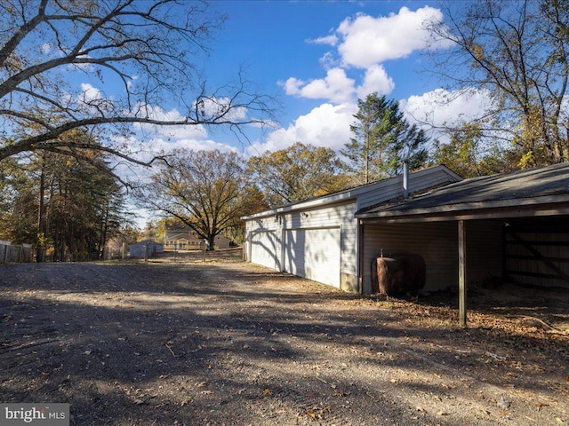 view of property exterior featuring an outbuilding