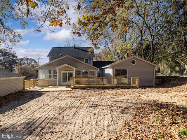 rear view of property with a deck