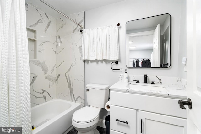 full bathroom with vanity, shower / tub combo, and toilet