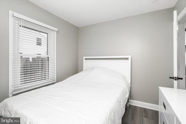 bedroom featuring dark wood-type flooring