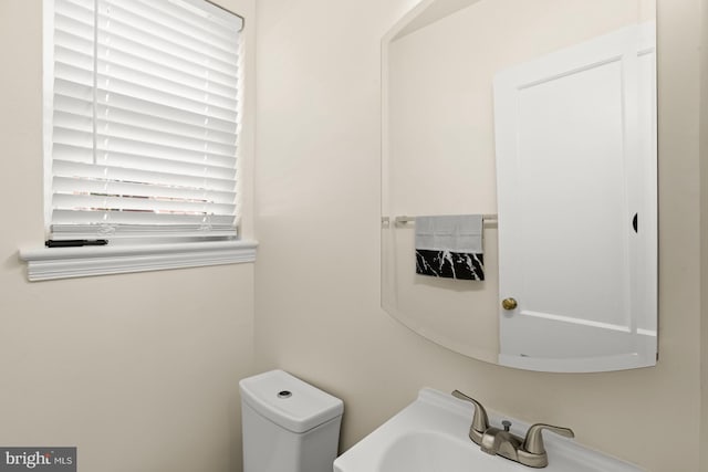 bathroom with sink and toilet