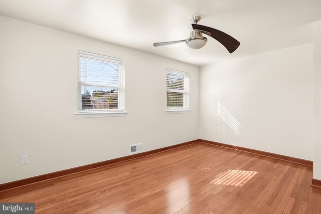 spare room featuring ceiling fan and light wood-type flooring