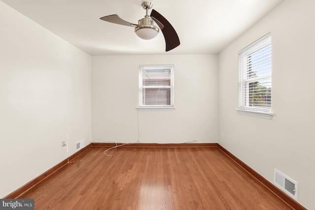 empty room featuring ceiling fan and light hardwood / wood-style floors