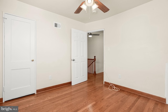 unfurnished bedroom with light hardwood / wood-style floors and ceiling fan