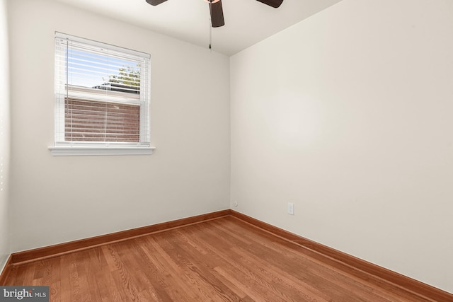 empty room featuring wood-type flooring and ceiling fan