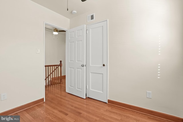 interior space with ceiling fan and light hardwood / wood-style flooring