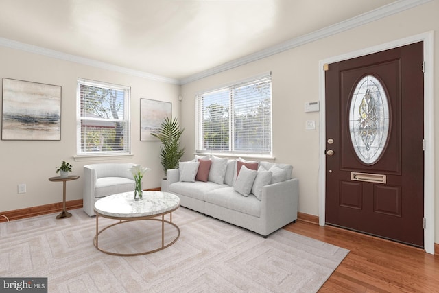 living room with light wood-type flooring and ornamental molding