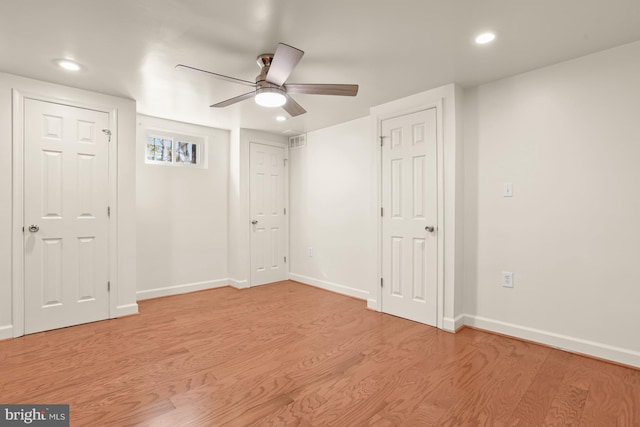 unfurnished room featuring light wood-type flooring and ceiling fan